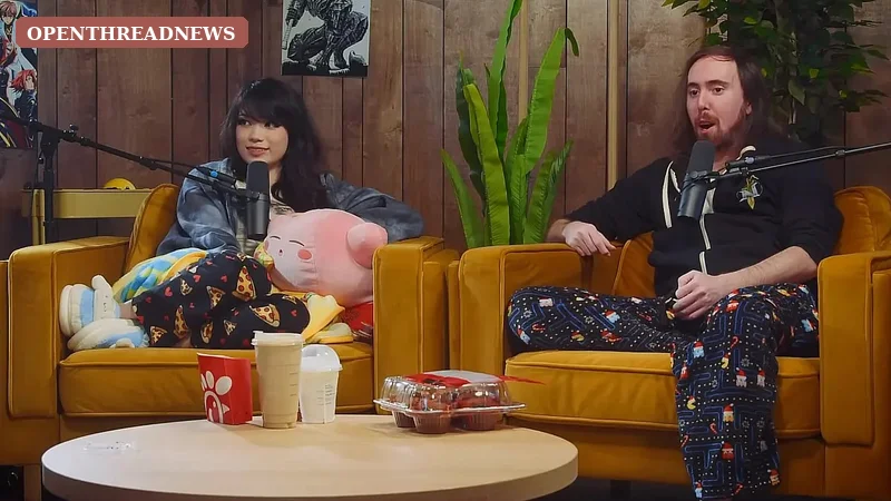 Three friends laughing around plain podcast microphones in a cozy studio, representing Emiru's Steak & Eggs Podcast recordings