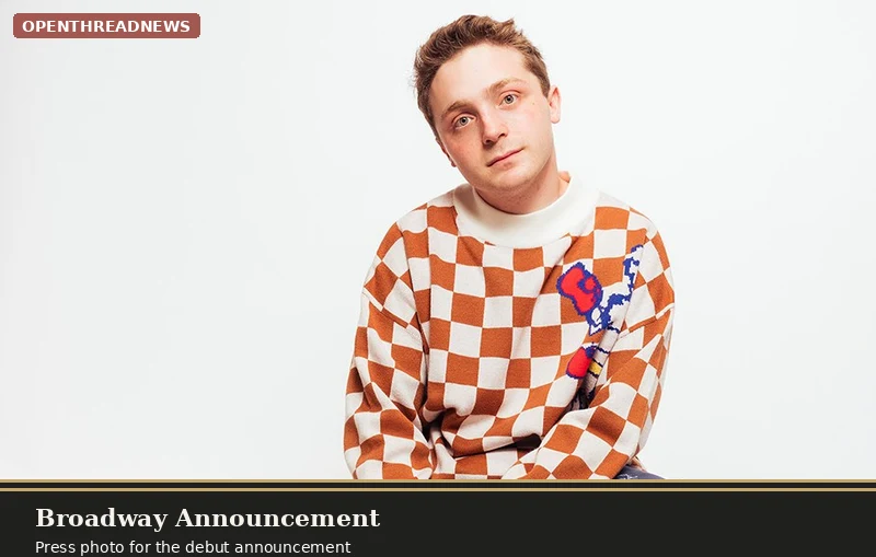 Jake Shane portrait in a checkered sweater