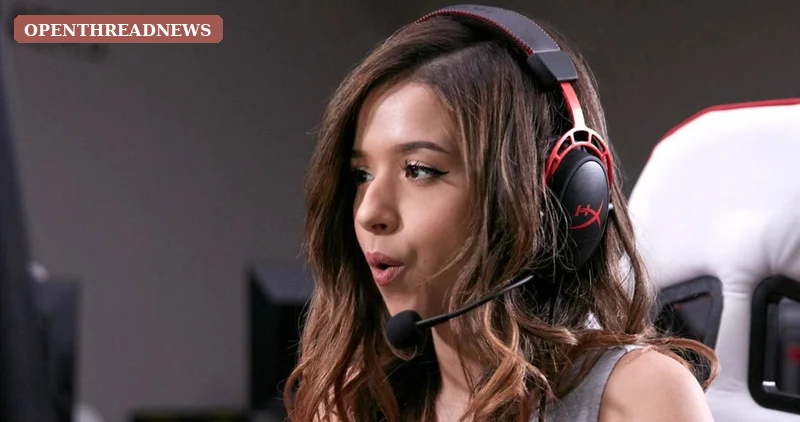 A young streamer excitedly playing a game on a dual-monitor PC in a college dorm room, where Pokimane's streaming career began
