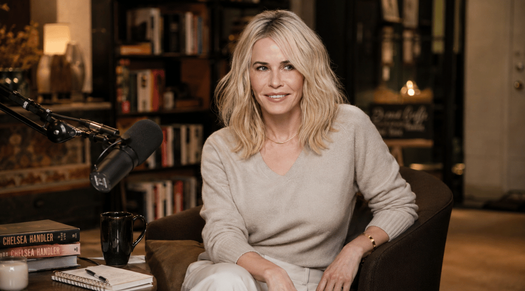 Chelsea Handler seated in a sophisticated recording studio reflecting her career as a bestselling author and podcast host