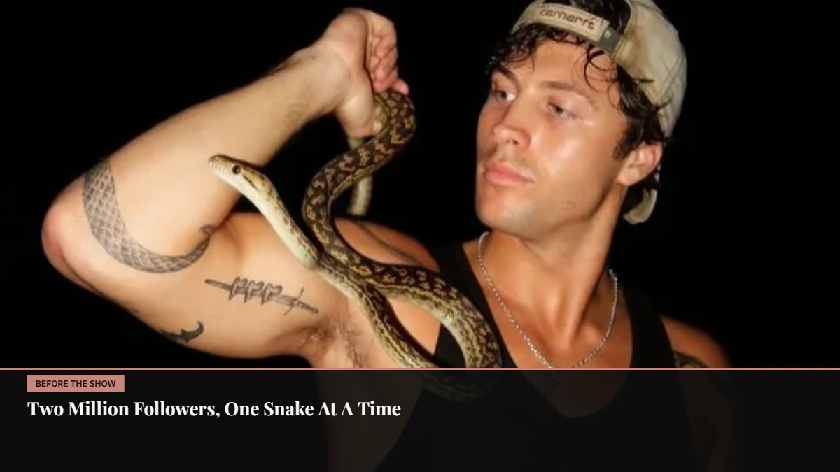 Rob Rausch holding a snake, the venomous snake wrangler whose work drew more than two million TikTok followers