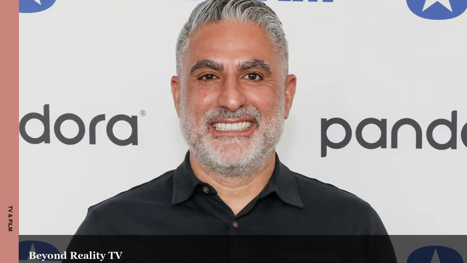 Reza Farahan smiling during a media interview appearance