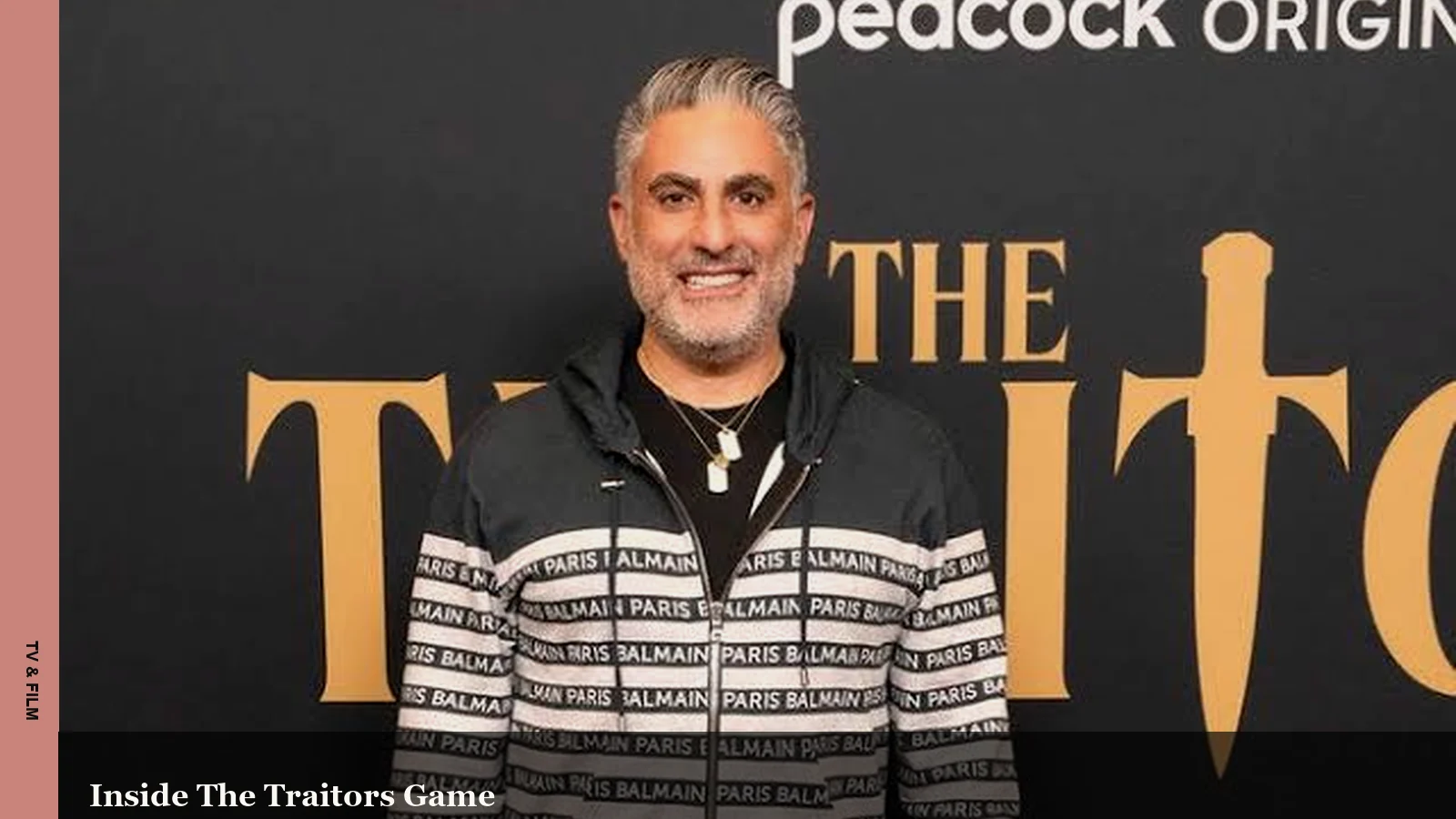 Reza Farahan at a Traitors promotional event backdrop