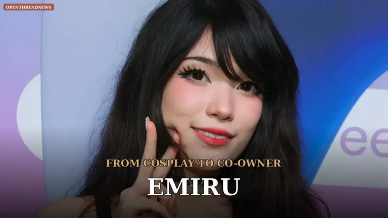 Emiru at a colorful LED-lit streaming setup with dual monitors and a microphone arm, smiling at the camera